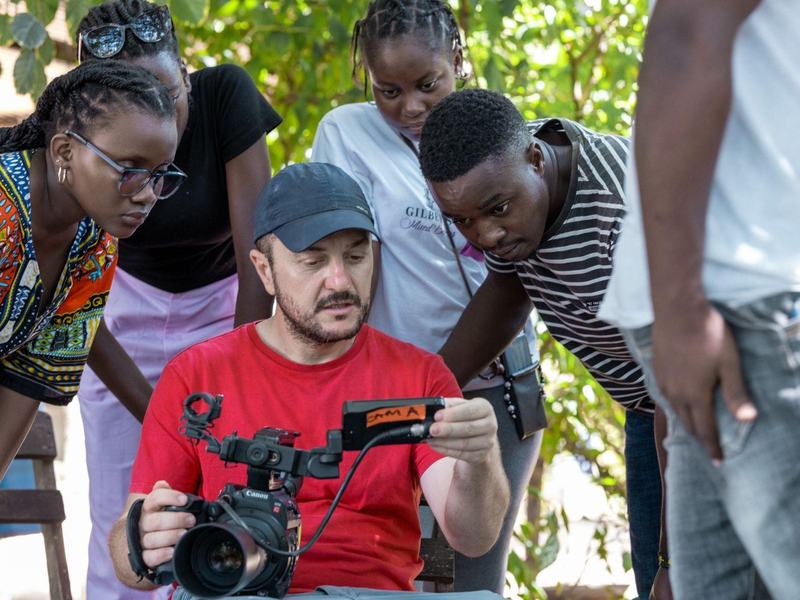 Students filming with a Canon camera during Hadithi za Pwani