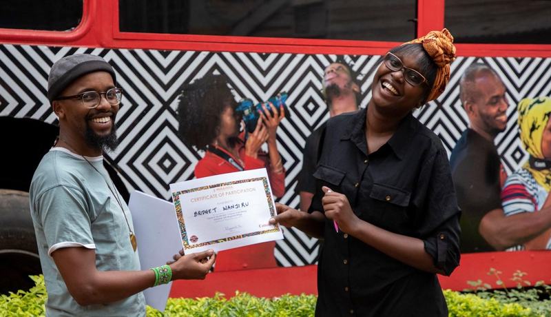 A student receives her certificate